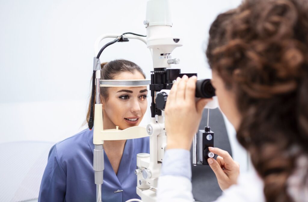 An adult having their eyes examined by an optometrist for a myopia control option.