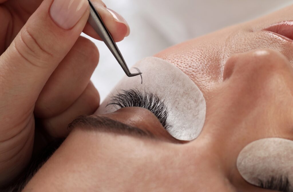 A person getting eyelash extensions.